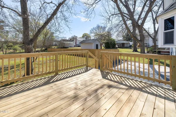 a view of a balcony with wooden floor