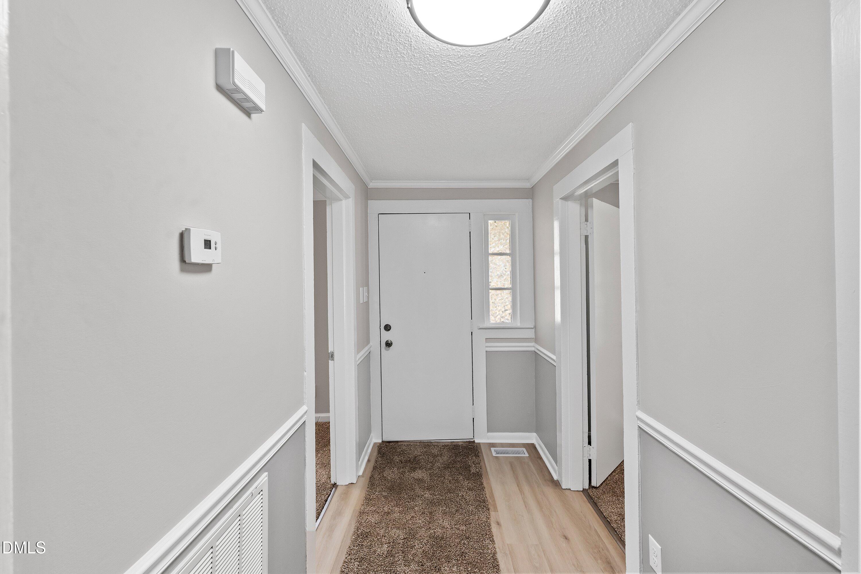 105 East I Street Erwin, NC 28339 - Photo 7 of 39 a view of a hallway with wooden floor and closet
