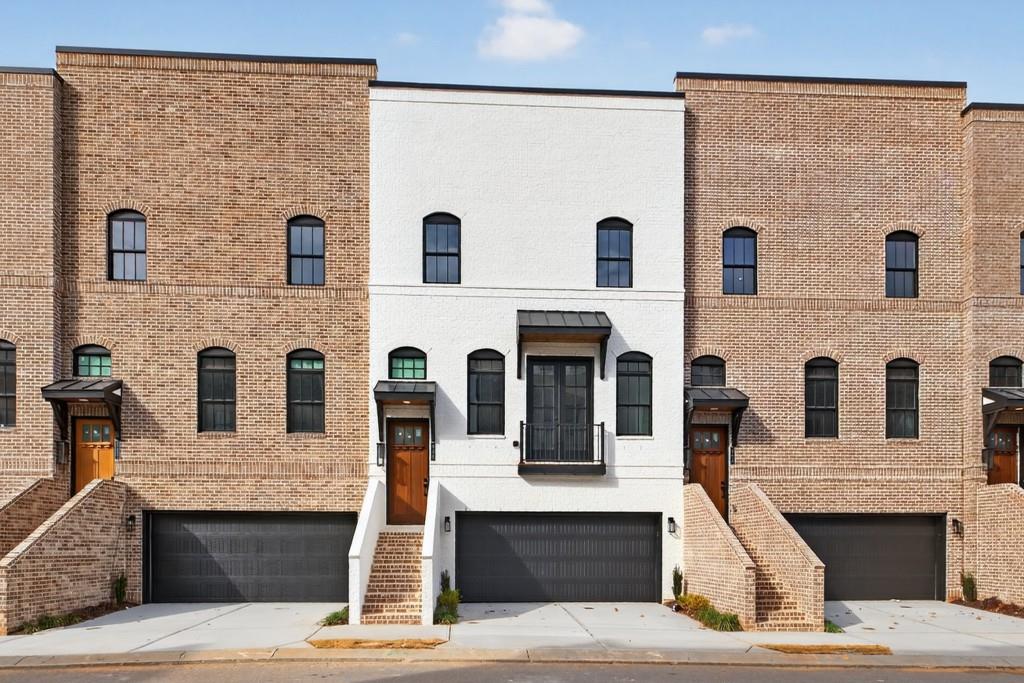 a front view of residential houses with stairs