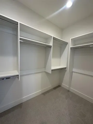 a view of an empty walk in closet