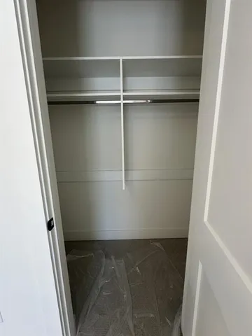 a view of wooden balcony with a bench