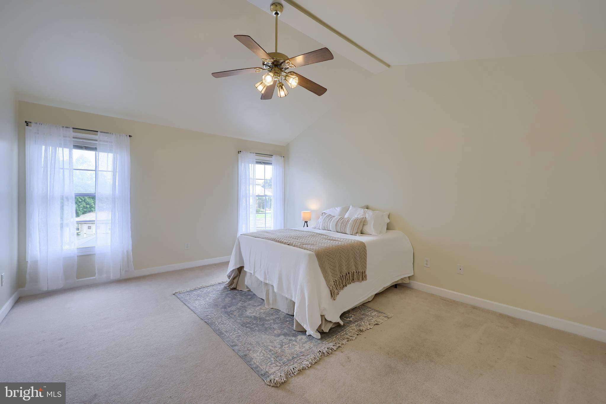 148 Michigan Drive Sinking Spring, PA 19608 - Photo 39 of 50 a spacious bedroom with a bed and a chandelier