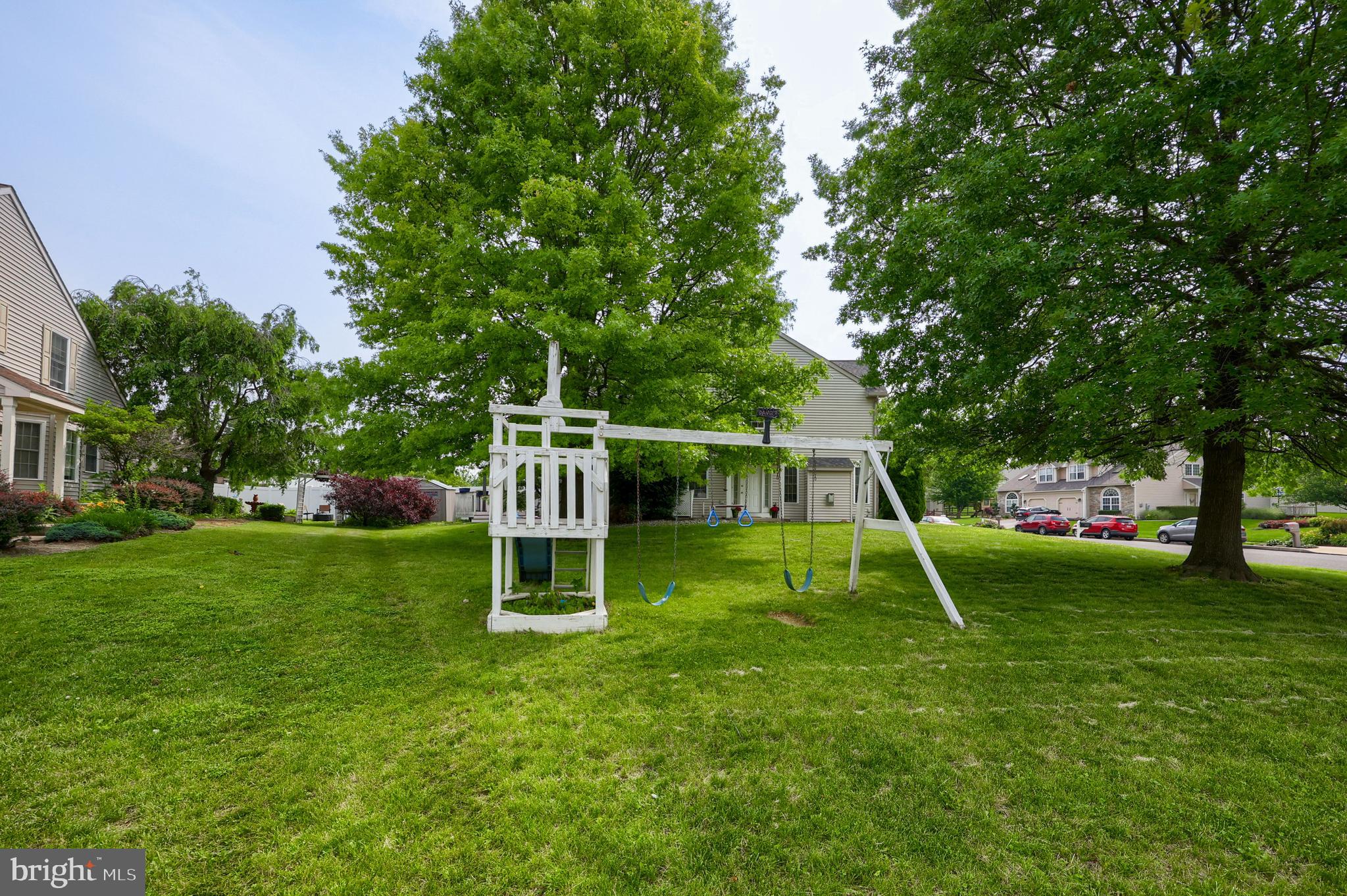 148 Michigan Drive Sinking Spring, PA 19608 - Photo 50 of 50 a view of a backyard with a slide trees and wooden fence