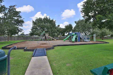 a view of a park with large trees