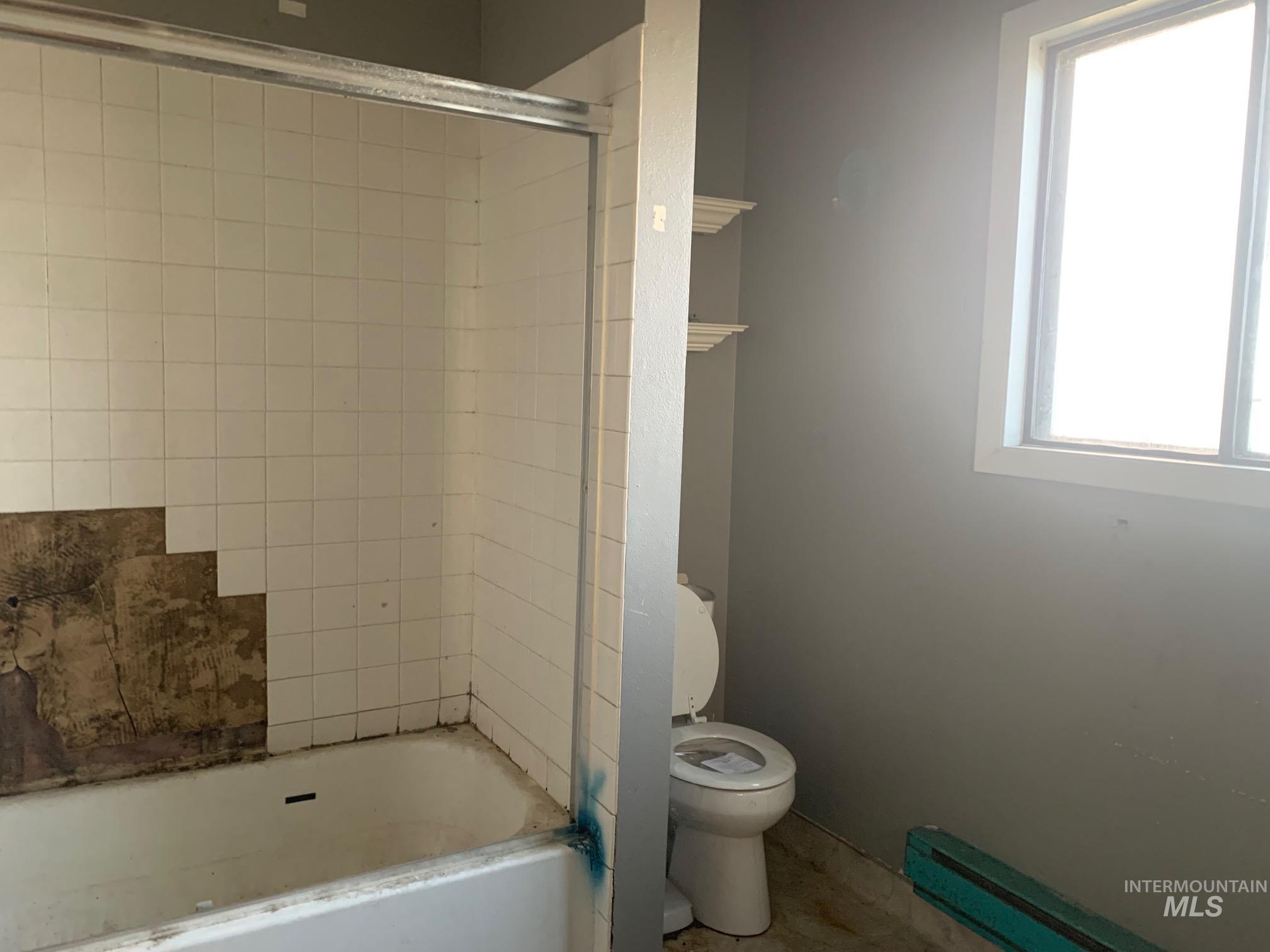 1435 Normal Burley, ID 83318 - Photo 9 of 9 Full bath featuring shower combination and a baseboard heating unit