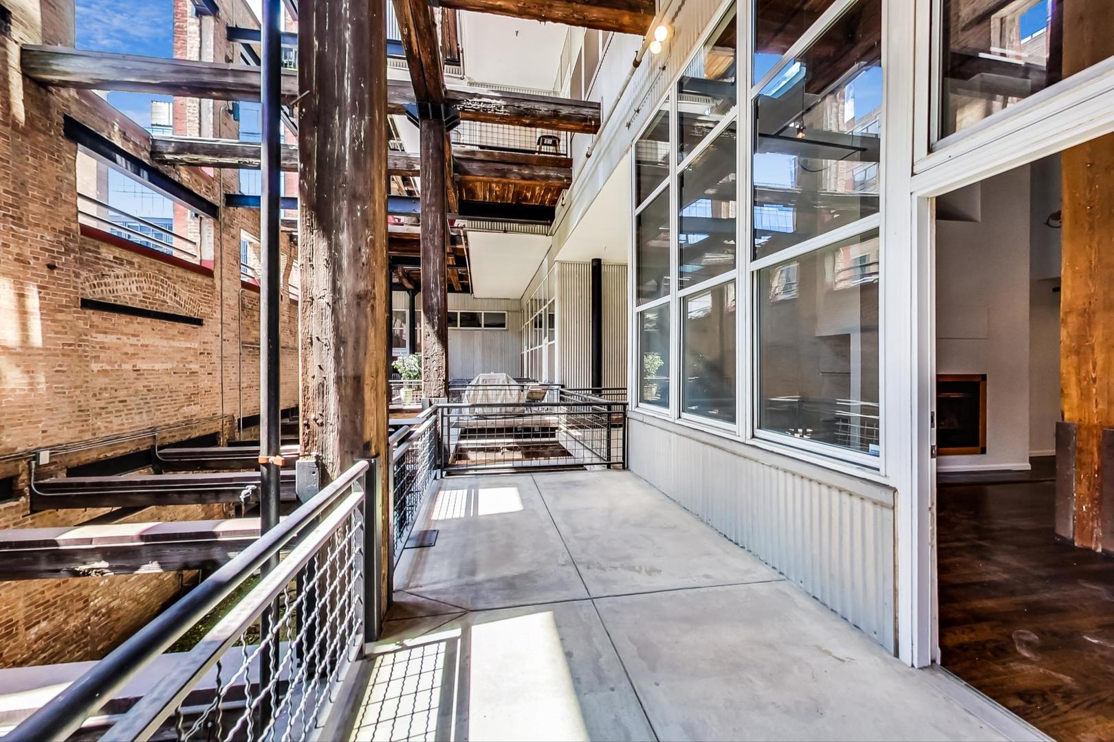 1000 West Washington Boulevard, Unit 130 Chicago, IL 60607 - Photo 20 of 47 a view of a balcony a stove and cabinets
