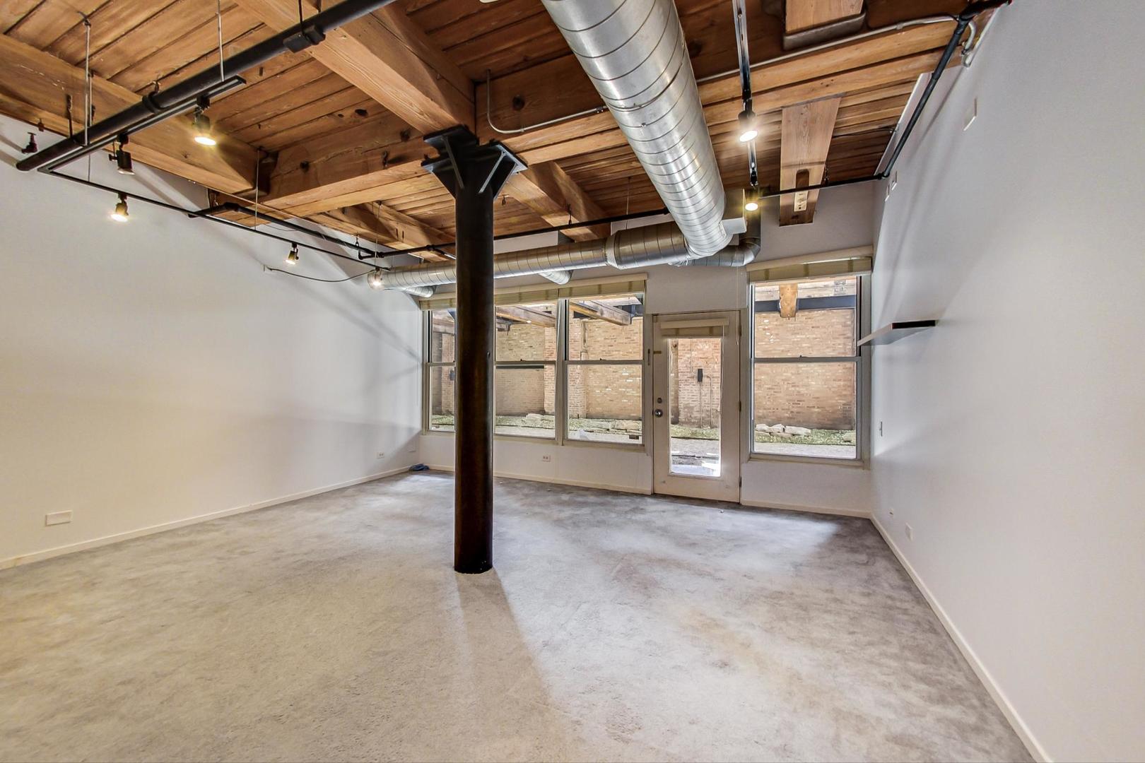 1000 West Washington Boulevard, Unit 130 Chicago, IL 60607 - Photo 31 of 47 a view of an empty room with windows