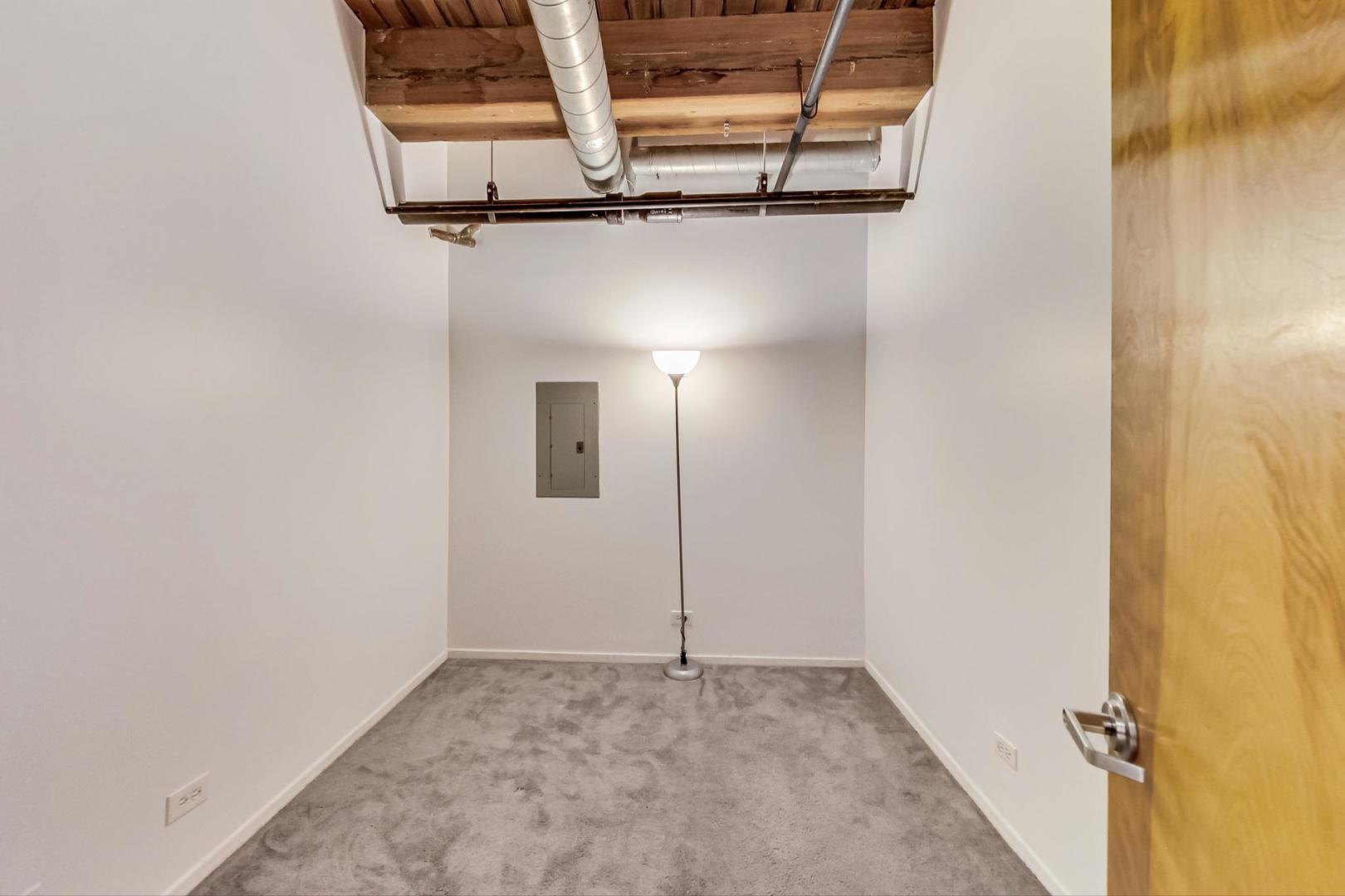 1000 West Washington Boulevard, Unit 130 Chicago, IL 60607 - Photo 34 of 47 a view of a room with rack on the wall