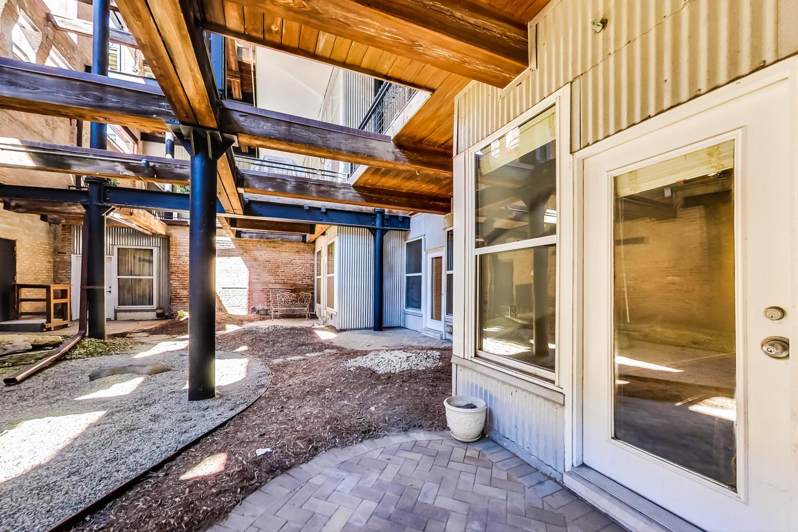 1000 West Washington Boulevard, Unit 130 Chicago, IL 60607 - Photo 38 of 47 a view of a brick building with a large window