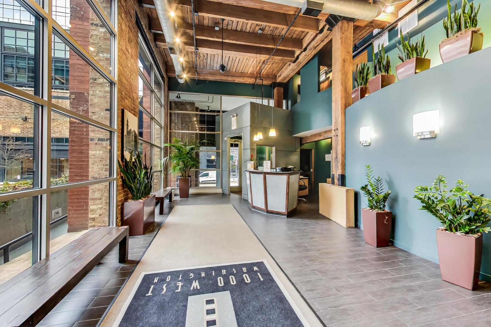 1000 West Washington Boulevard, Unit 130 Chicago, IL 60607 - Photo 7 of 47 a lobby with furniture and a potted plant