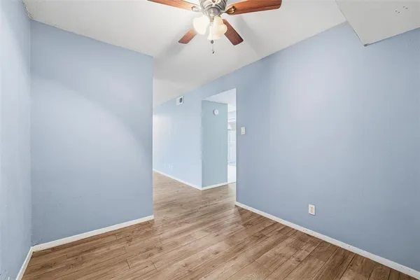 wooden floor in an empty room and a window