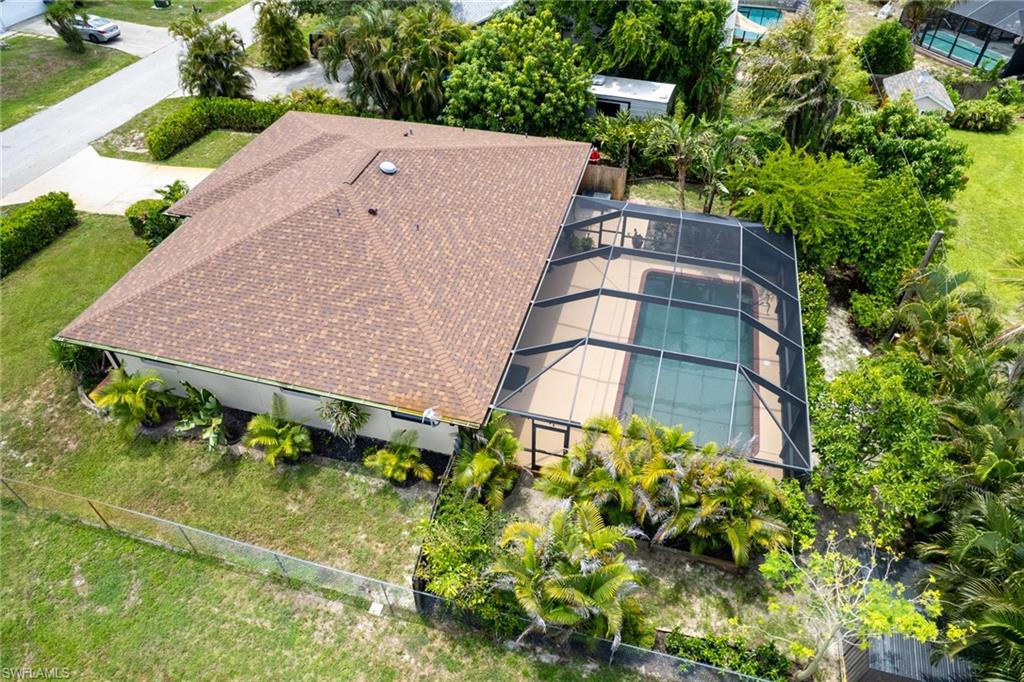18414 Tulip Road Fort Myers, FL 33967 - Photo 2 of 37 Enclosed pool area featuring a rectangular pool with a screened enclosure