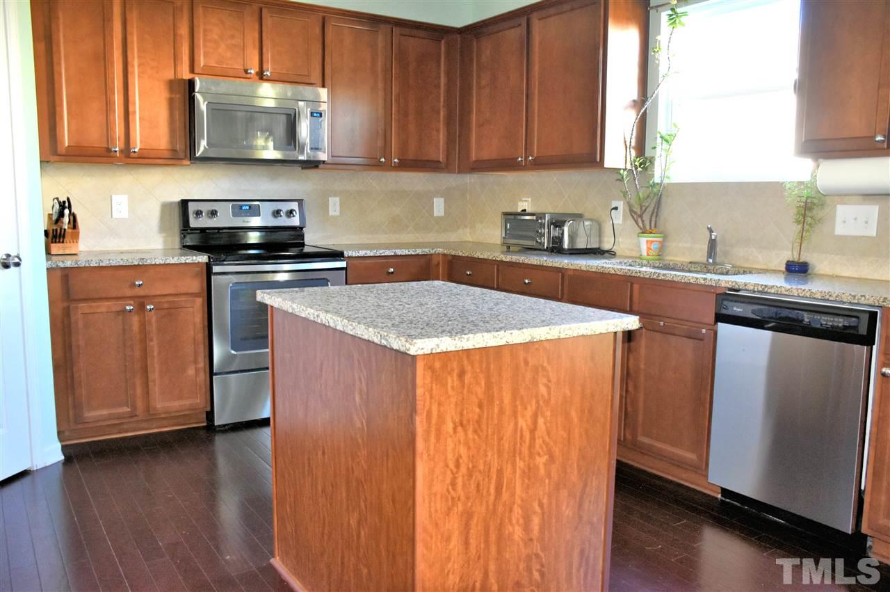 8137 Hovingham Way Raleigh, NC 27616 - Photo 3 of 20 Very nice granite top island, perfect for entertaining.