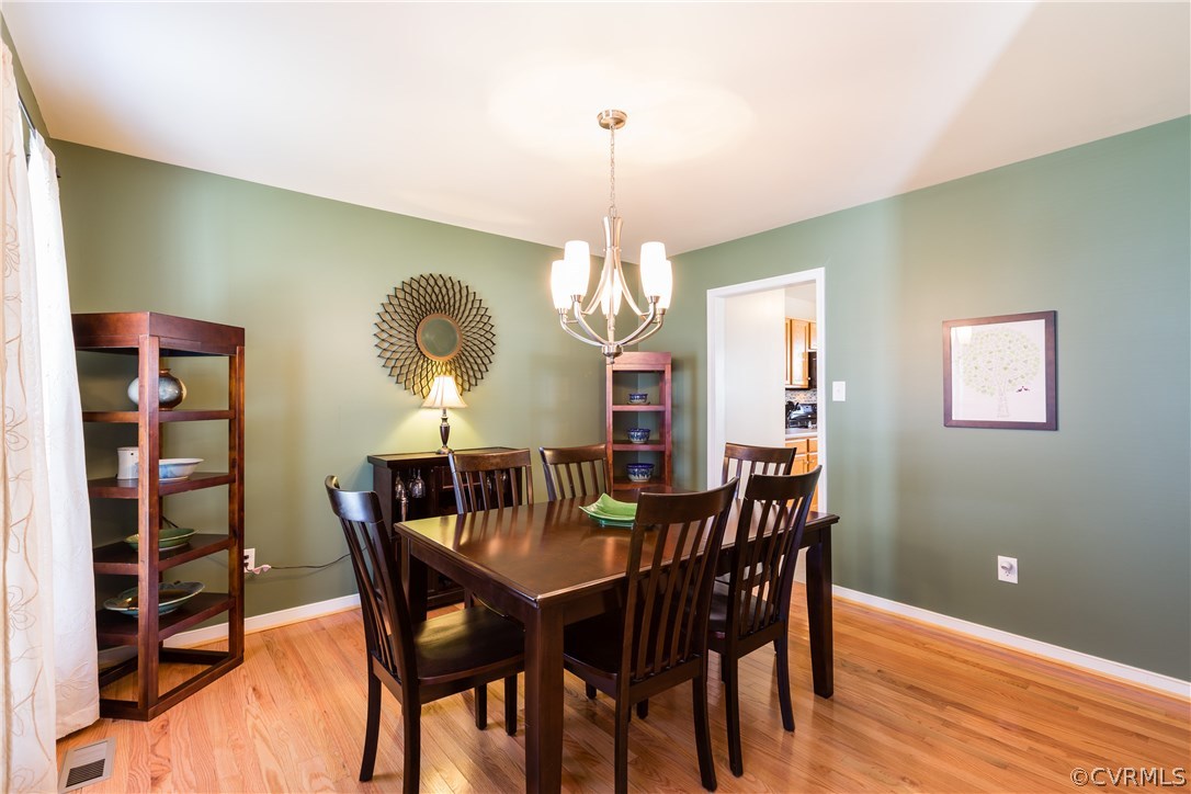 9718 Gdn Rdg Trace Chesterfield, VA 23832 - Photo 3 of 30 a view of a dining room with furniture window and wooden floor