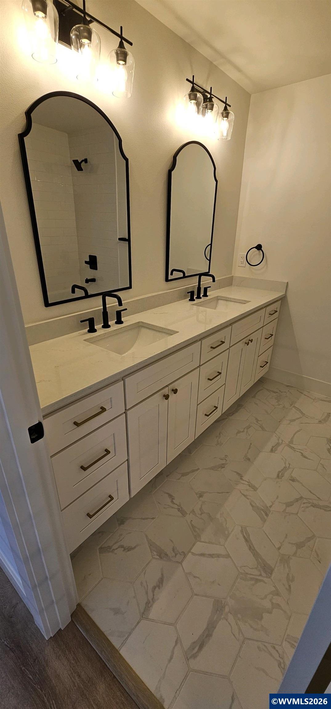 Model B Salishan Street Southeast Salem, OR 97302 - Photo 17 of 30 a bathroom with a double vanity sink and a mirror