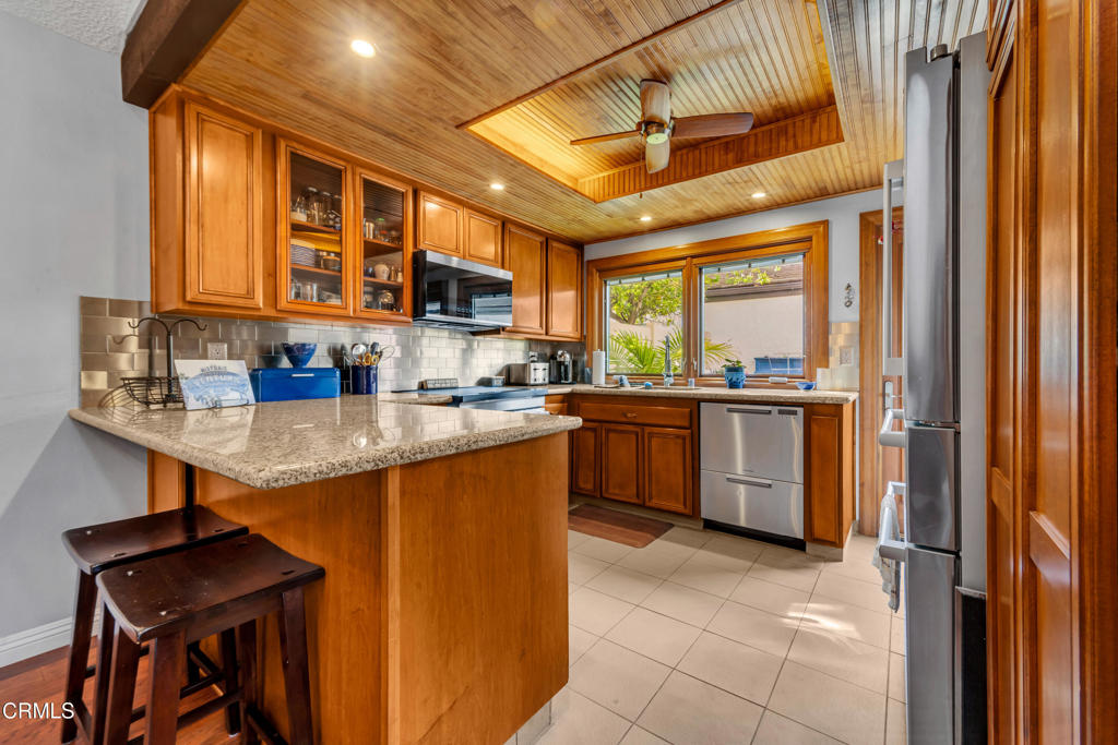 5290 Shiloh Way Ventura, CA 93003 - Photo 6 of 22 a kitchen with a sink a stove and cabinets
