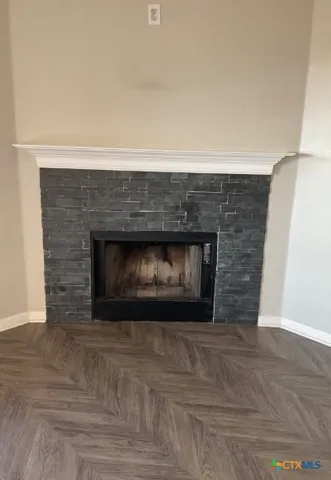 a fireplace with a vase