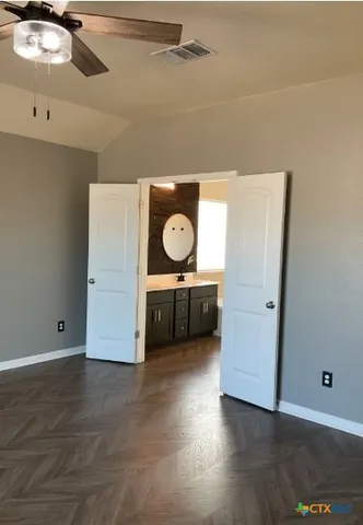 a bathroom with a double vanity sink and mirror