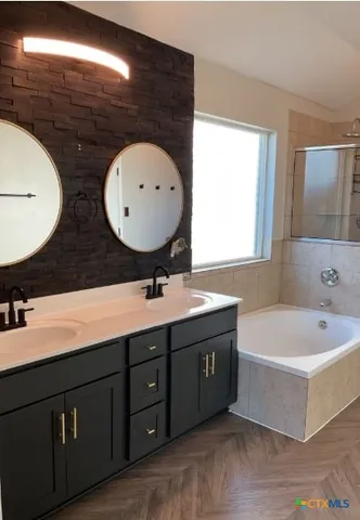 a bathroom with a sink and a mirror