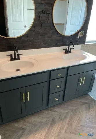a bathroom with a bathtub and a sink