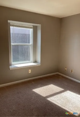 a bathroom with double sink and a mirror