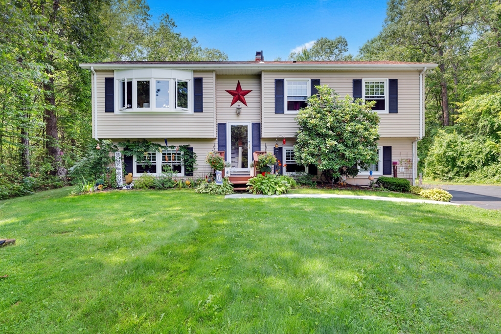 150 Osborne Road Ware, MA 01082 - Photo 1 of 38 a front view of house with yard and green space