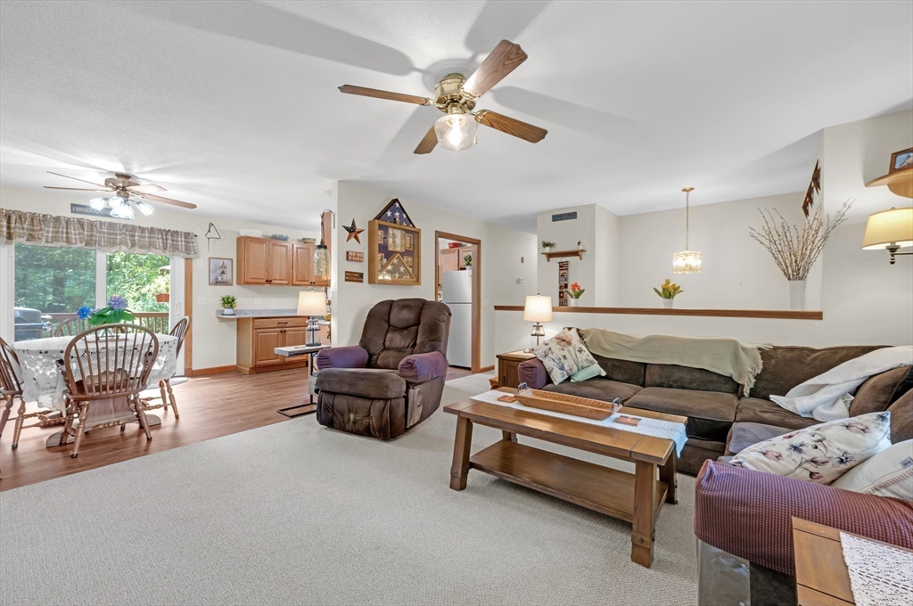 150 Osborne Road Ware, MA 01082 - Photo 19 of 38 a living room with furniture and a fireplace