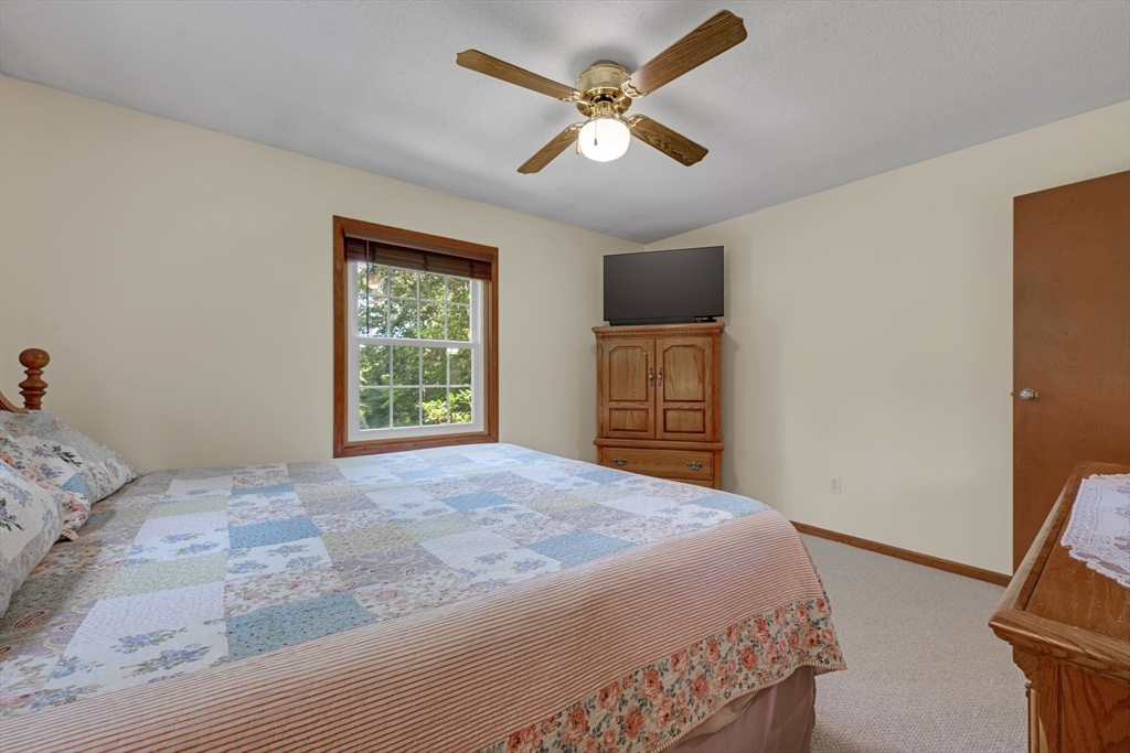 150 Osborne Road Ware, MA 01082 - Photo 24 of 38 a bedroom with a bed and a television