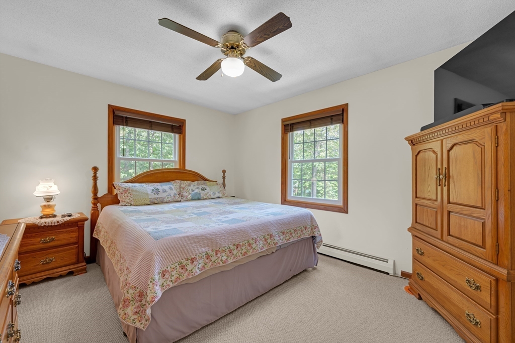 150 Osborne Road Ware, MA 01082 - Photo 25 of 38 a bedroom with a bed and a large window