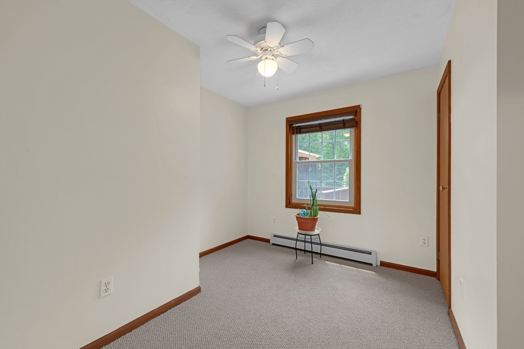 150 Osborne Road Ware, MA 01082 - Photo 27 of 38 an empty room with a window and a ceiling fan