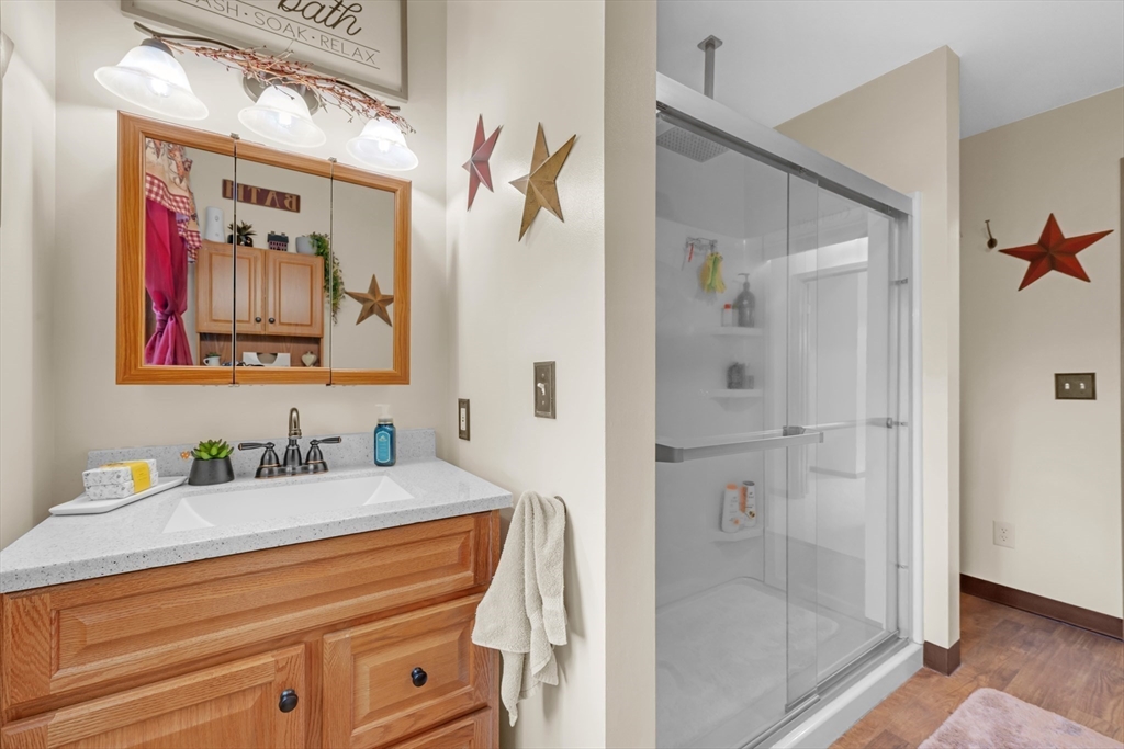 150 Osborne Road Ware, MA 01082 - Photo 28 of 38 a bathroom with a granite countertop sink mirror and shower