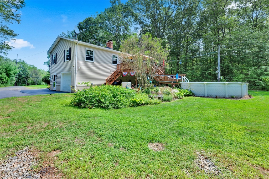 150 Osborne Road Ware, MA 01082 - Photo 3 of 38 a view of a house with backyard and garden