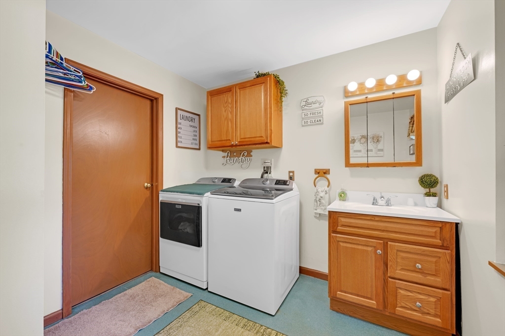 150 Osborne Road Ware, MA 01082 - Photo 33 of 38 a kitchen with a refrigerator sink and cabinets
