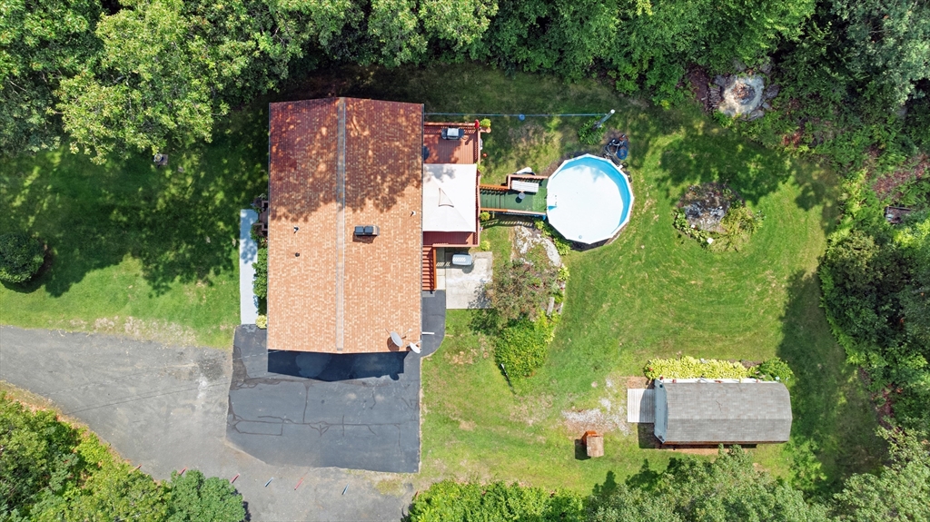 150 Osborne Road Ware, MA 01082 - Photo 34 of 38 a aerial view of a house with a swimming pool and large trees