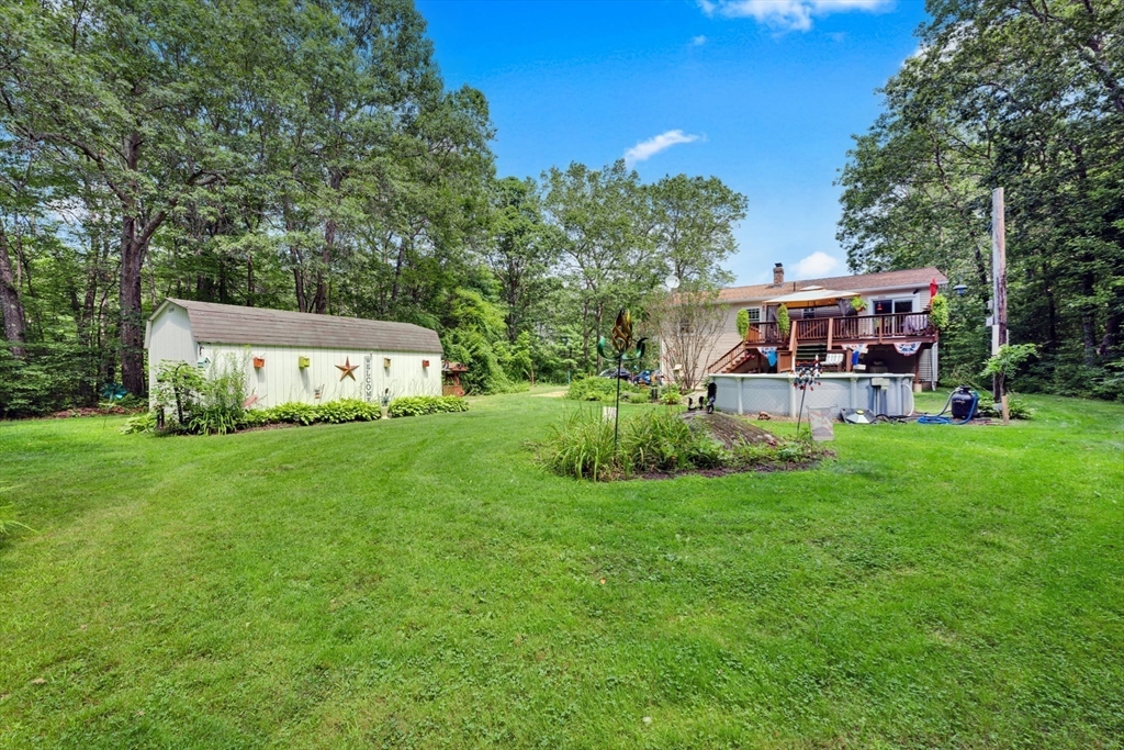 150 Osborne Road Ware, MA 01082 - Photo 4 of 38 a front view of a house with garden