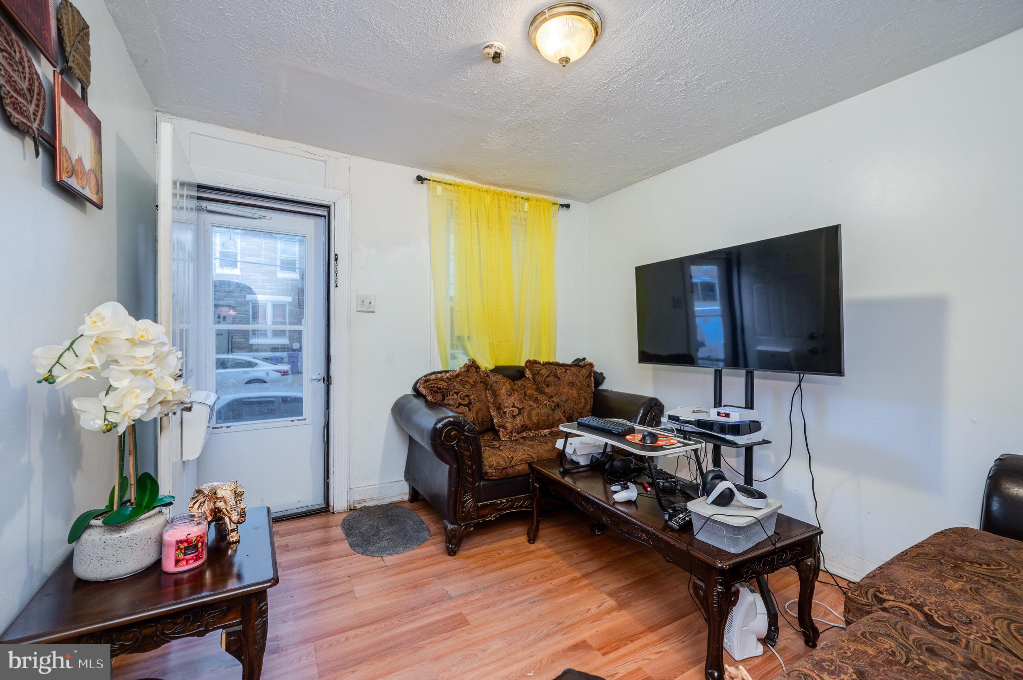 419 North 2nd Street Reading, PA 19601 - Photo 12 of 34 a living room with furniture and a flat screen tv