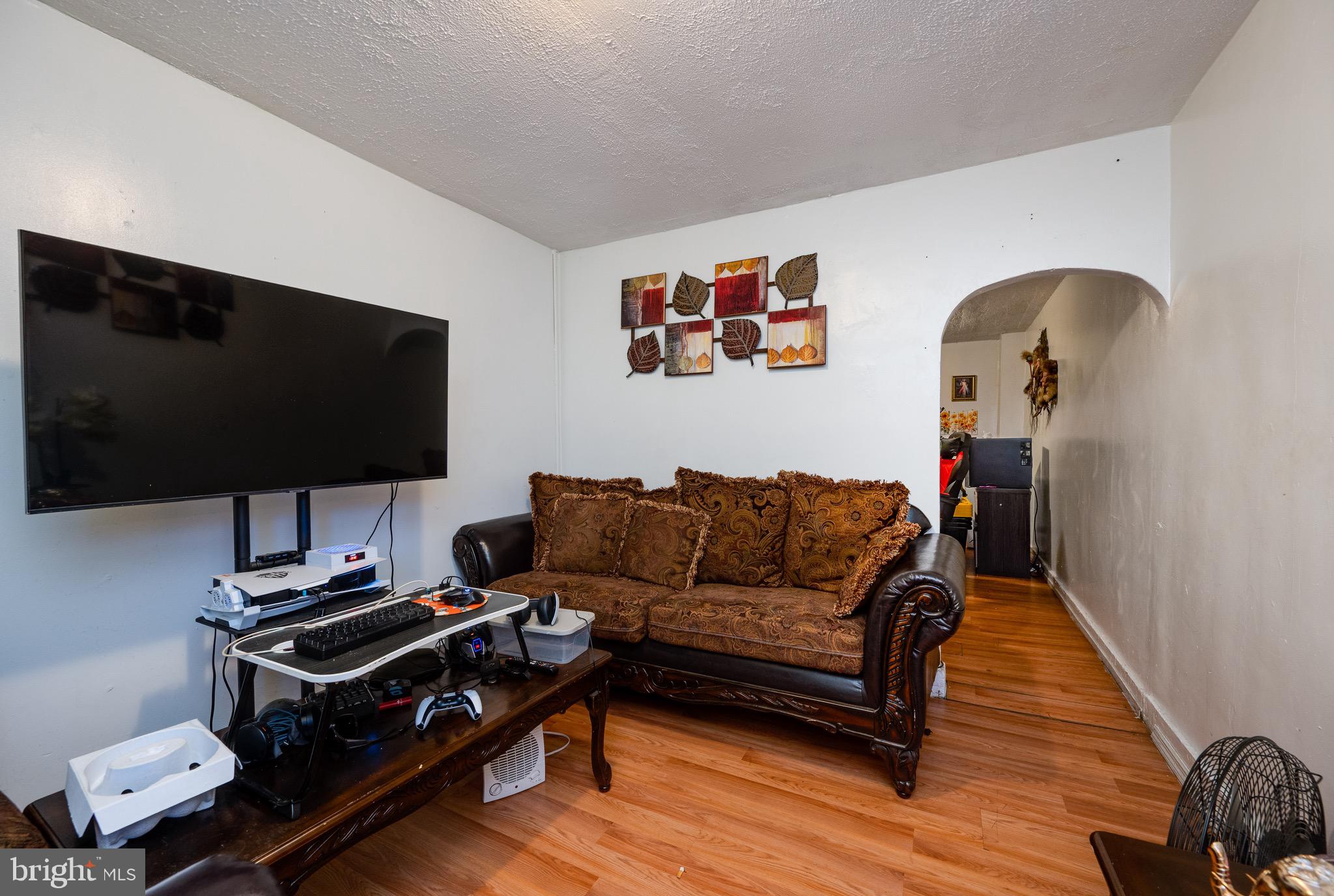 419 North 2nd Street Reading, PA 19601 - Photo 13 of 34 a living room with furniture and a flat screen tv