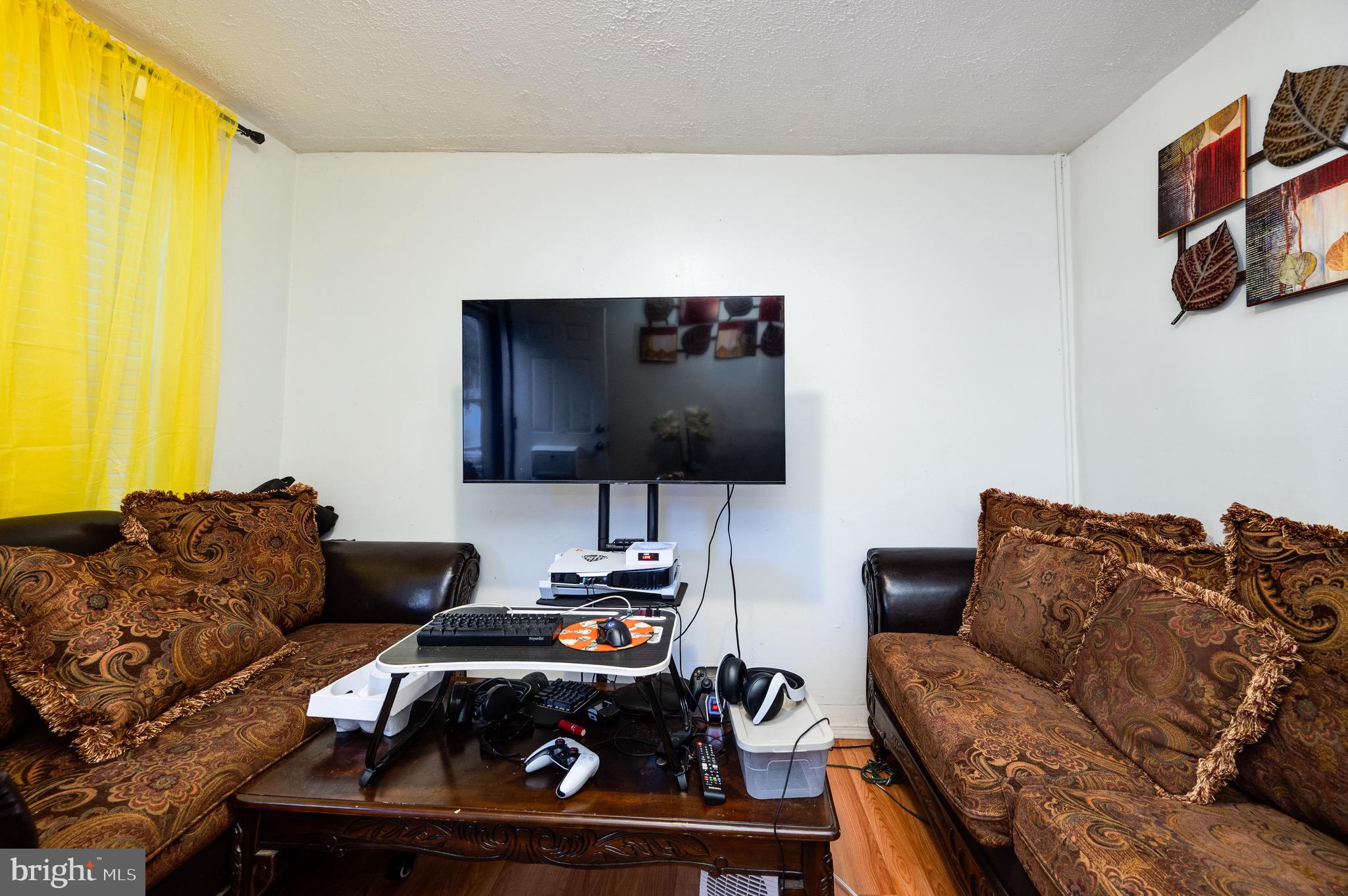 419 North 2nd Street Reading, PA 19601 - Photo 14 of 34 a living room with furniture and a flat screen tv
