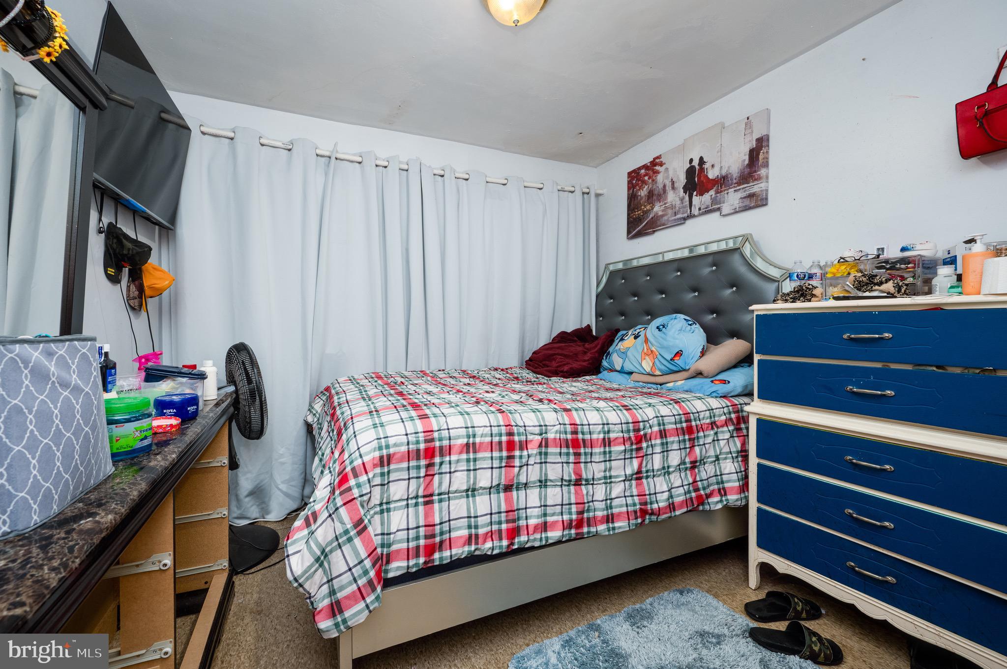 419 North 2nd Street Reading, PA 19601 - Photo 27 of 34 a bedroom with a bed and cabinets