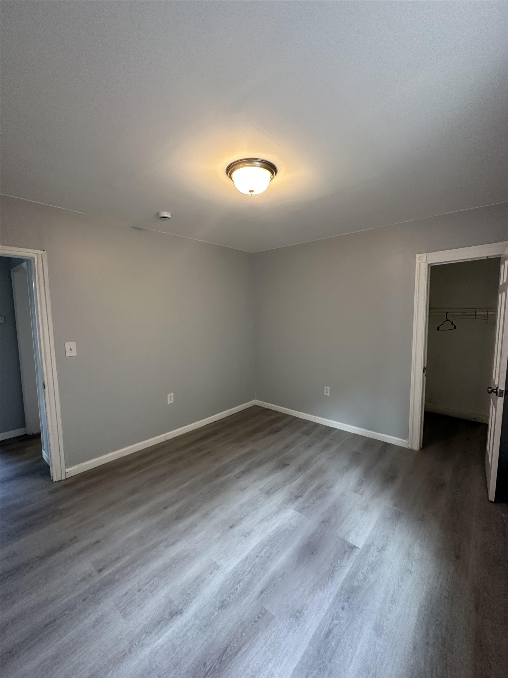 35 Norfolk Street, Unit 3 Newark, NJ 07103 - Photo 17 of 24 an empty room with wooden floor and windows