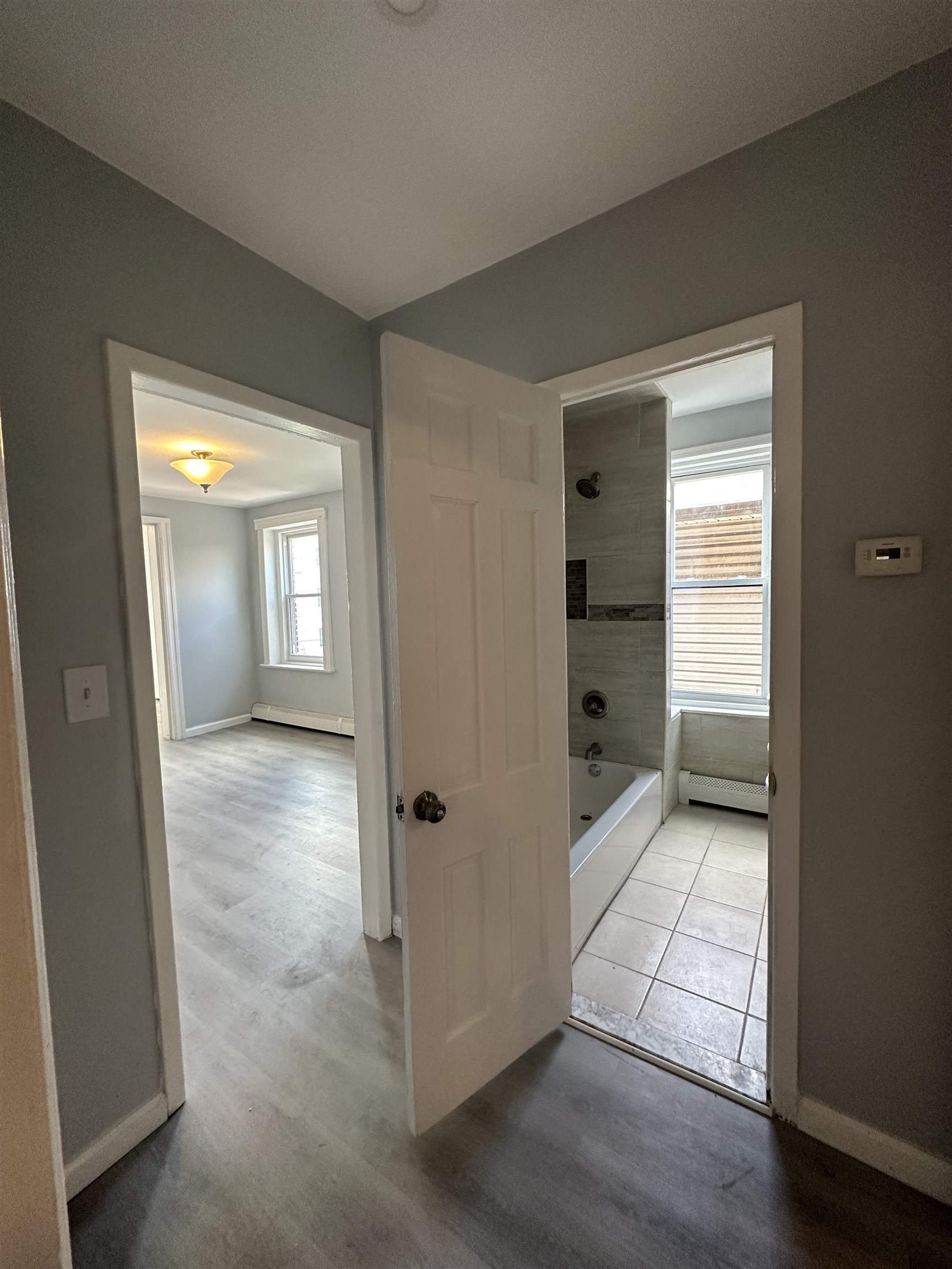 35 Norfolk Street, Unit 3 Newark, NJ 07103 - Photo 18 of 24 a view of a hallway with wooden shelves