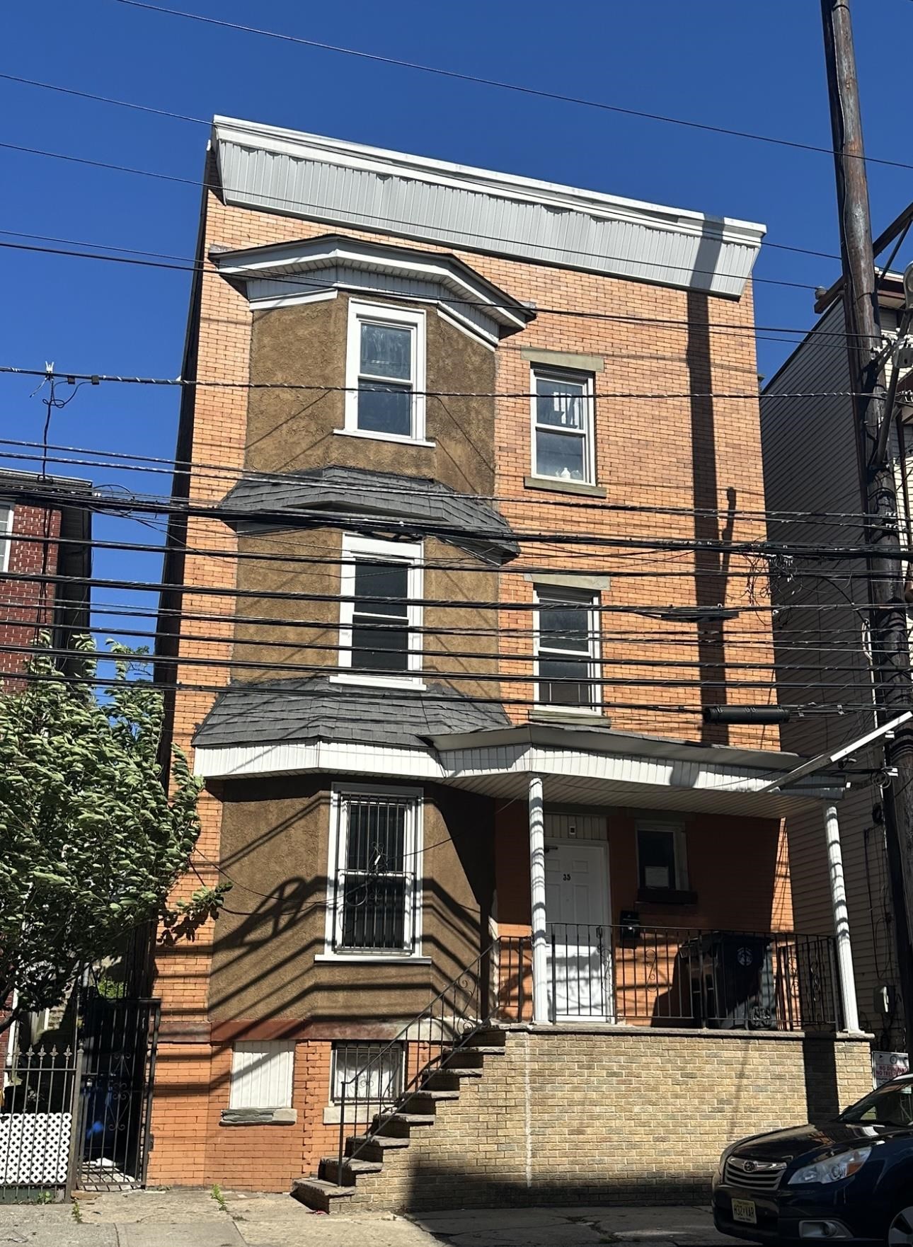 35 Norfolk Street, Unit 3 Newark, NJ 07103 - Photo 2 of 24 a view of a house with car parked on the road