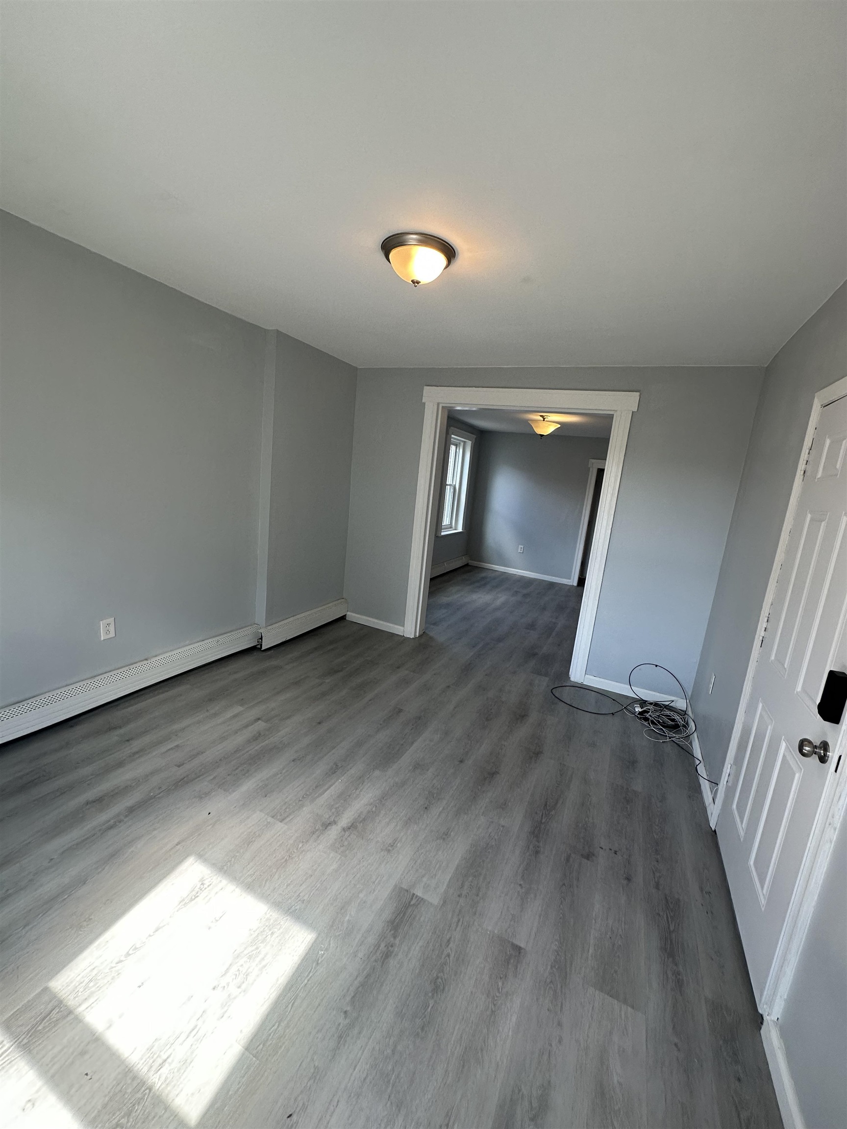 35 Norfolk Street, Unit 3 Newark, NJ 07103 - Photo 4 of 24 a view of empty room with wooden floor