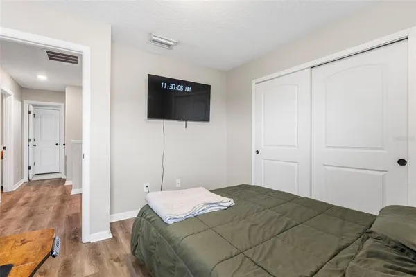 a bedroom with a bed and a view of bathroom