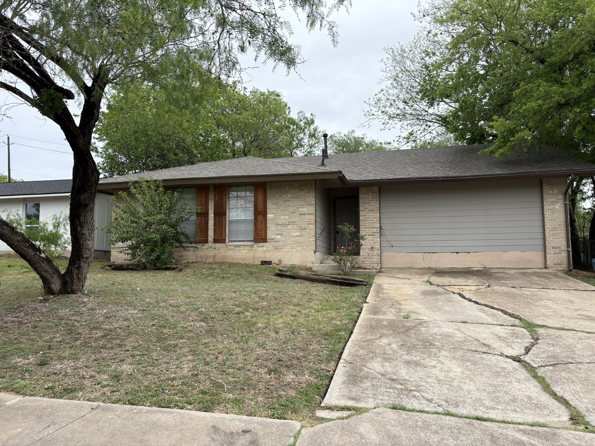 2524 Chaparral Trail Austin, TX 78744 - Photo 1 of 1 a front view of a house with garden