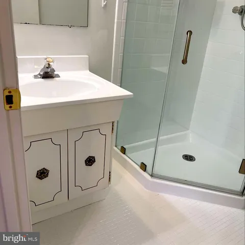 a bathroom with a bathtub and shower