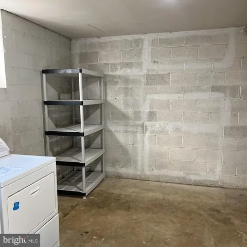 a room with a furniture and storage