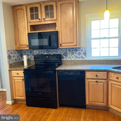 a kitchen with a cabinets and a stove