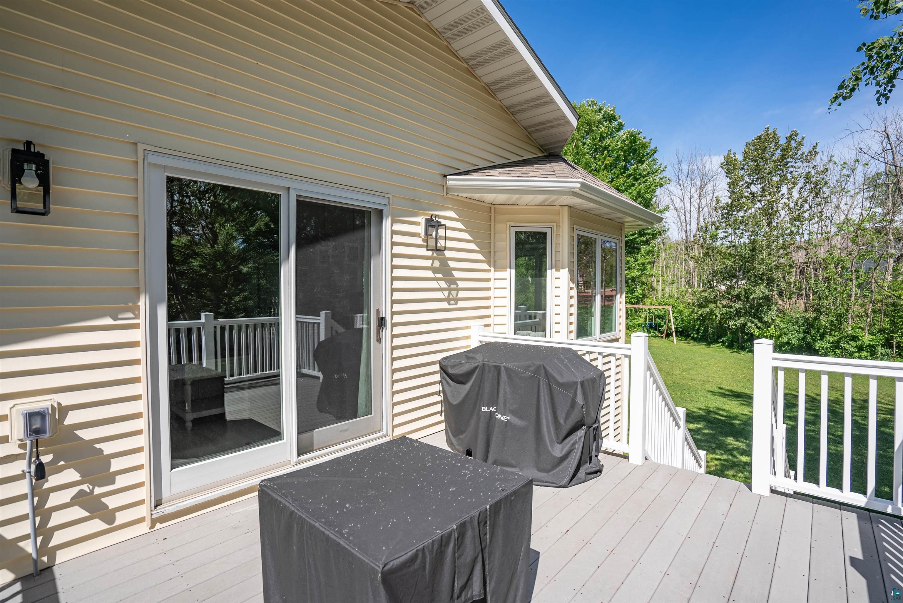 4809 Oak Ridge Drive Hermantown, MN 55811 - Photo 7 of 67 Exterior deck featuring gray planking and white railings