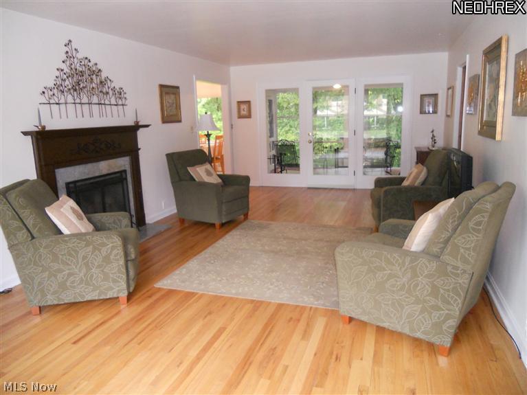 1910 Temblethurst Road South Euclid, OH 44121 - Photo 2 of 13 Living Room with Gorgeous Refinished Hardwood Floors and Wood Burning Fireplace